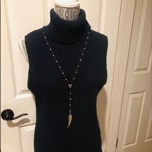 Sleeveless turtleneck sweater